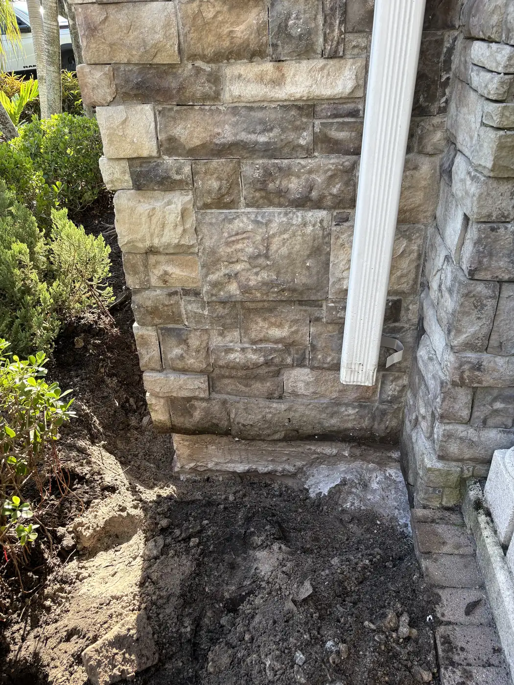 Foundation Excavated Below Stone Veneer for Waterproofing