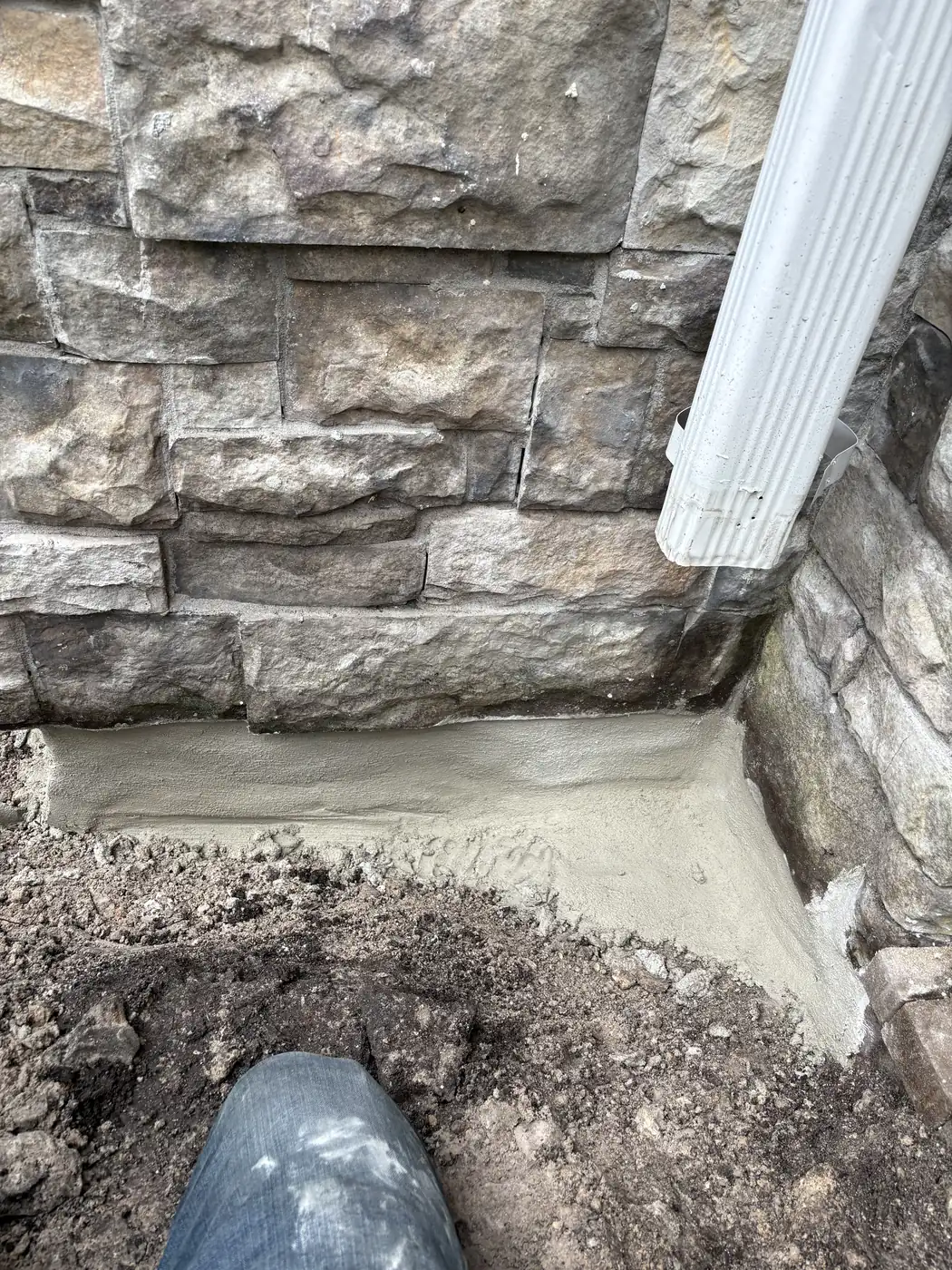 Cementitious Parge Coat Applied to Foundation Wall