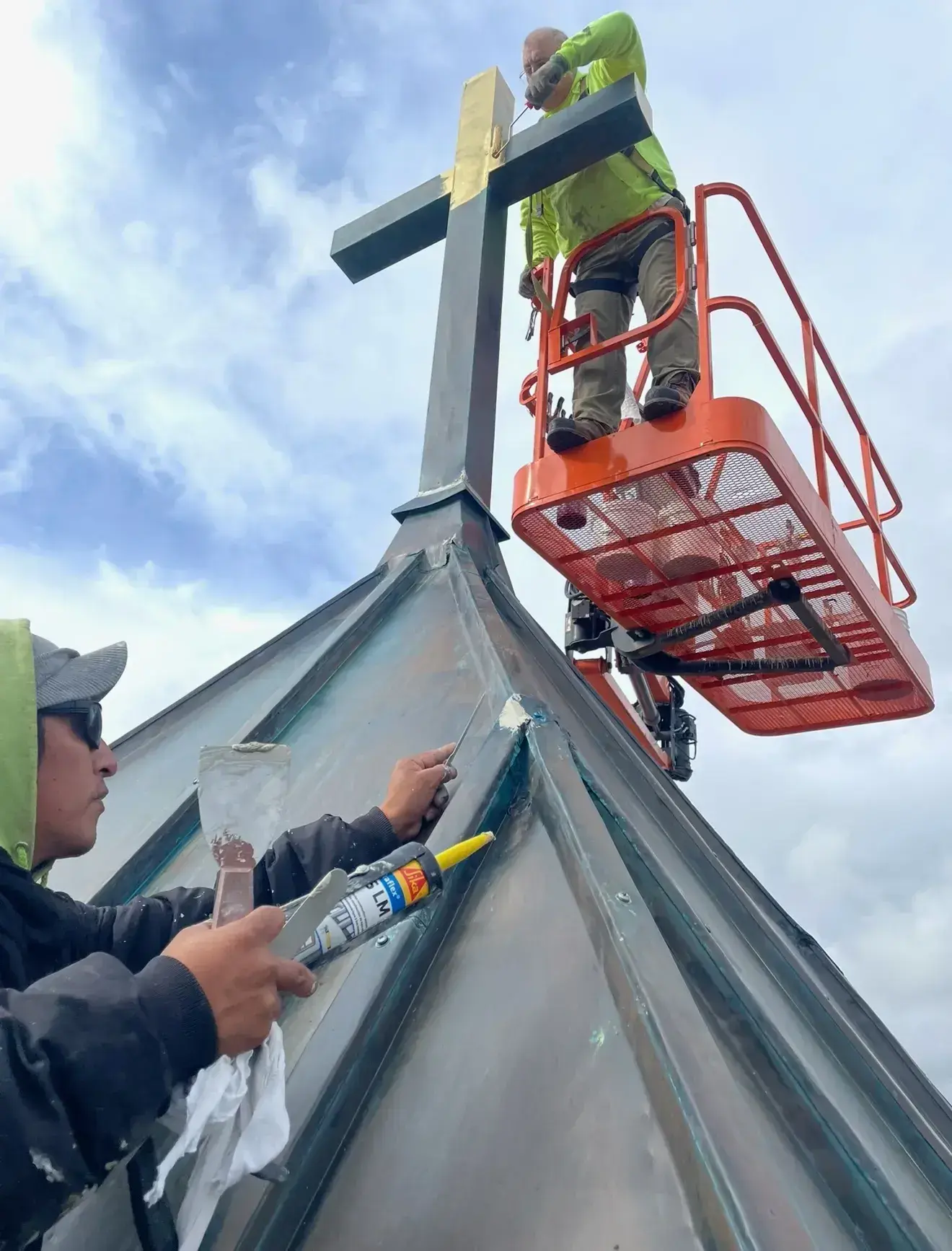 Professional church restoration work showing specialized techniques and equipment