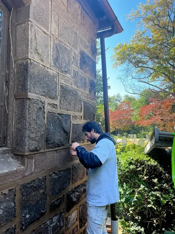 Paul Pennacchi Jr. cutting stone at First Episcopalian Church, Christ Church Parish in Bordentown